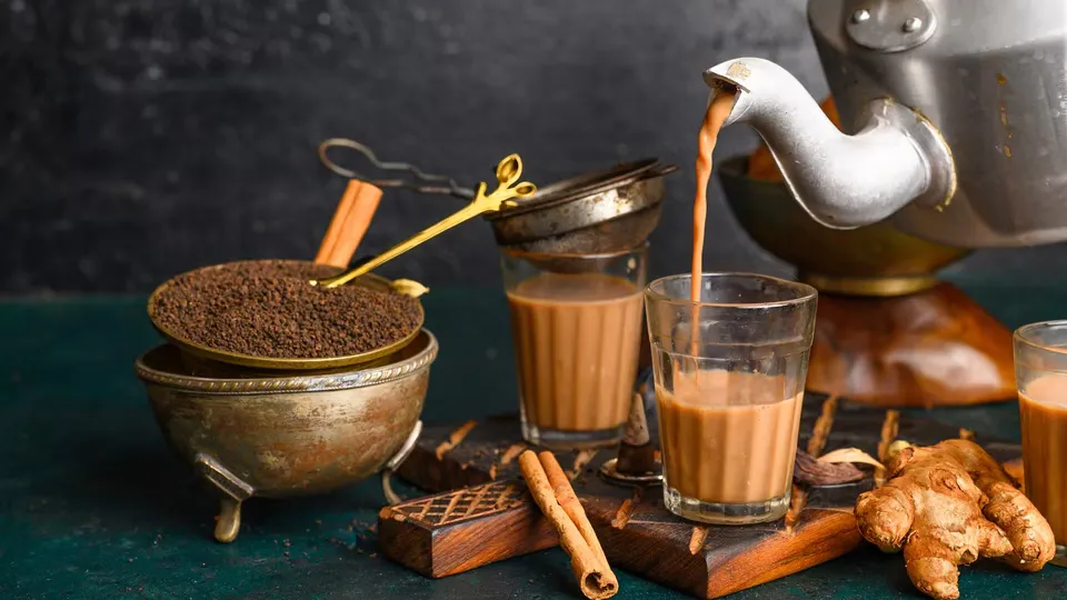 Chai poured fresh from the kettle into a cutting glass
